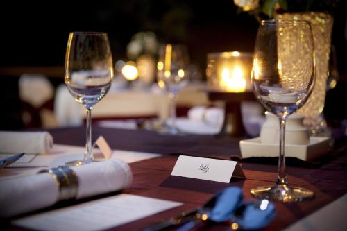 two wine glasses sitting on top of a table at Komaneka at Bisma Ubud in Ubud
