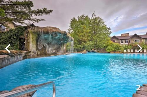 a large swimming pool with a waterfall in the middle at Majesty mountains The Great spirit of Wakan Tanka in Vernon Township