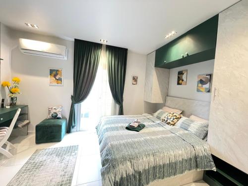 a bedroom with a large bed and a window at Luxury Studio House 589-1 in 6th Of October