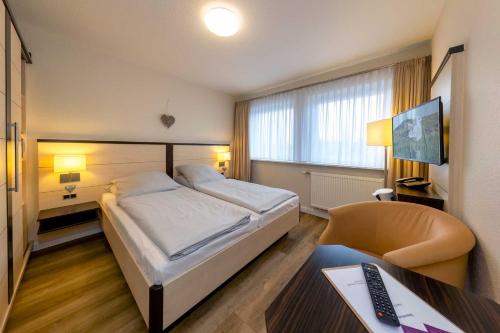 Postel nebo postele na pokoji v ubytování Landgasthof Struckum