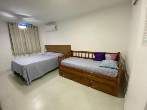 Postel nebo postele na pokoji v ubytování ARRAIAL Caribe Brasileiro