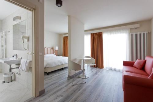 Postel nebo postele na pokoji v ubytování Hotel Delle Alpi