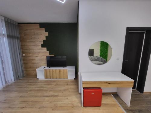 a room with a desk and a mirror on a wall at Вилно селище PARADISE VIEW in Sarnitsa