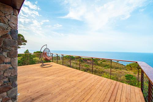 a balcony with a view of the ocean at Tenuta Delle Ripalte in Capoliveri
