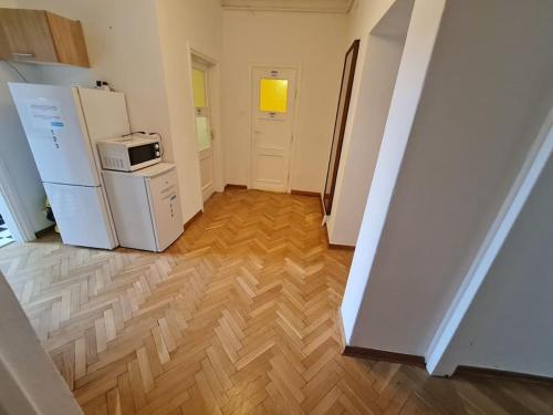 a kitchen with a refrigerator and a microwave at Fantastic - O13 Room F in Warsaw