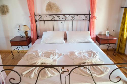 Ένα ή περισσότερα κρεβάτια σε δωμάτιο στο Ioanna 's Place