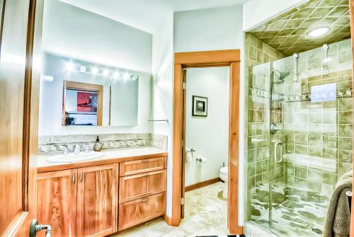 a bathroom with a shower and a sink and a toilet at Villa BG in Steamboat Springs