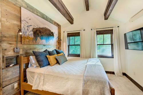 a bedroom with a bed with blue and yellow pillows at Gunnison Retreat about 3 Mi to Western CO University! in Gunnison