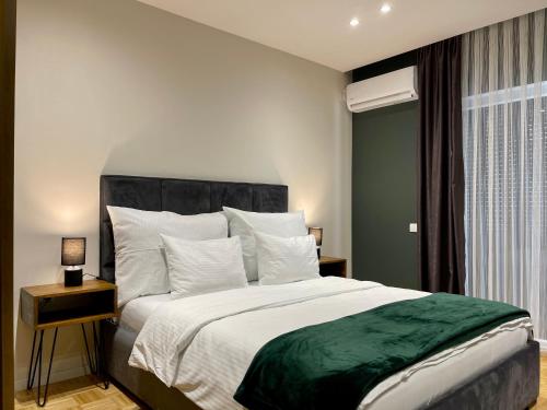 Postel nebo postele na pokoji v ubytování Premium Apartments