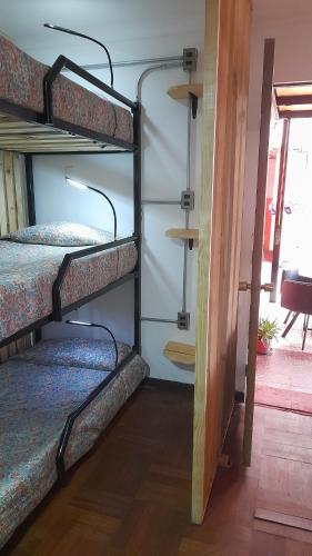 Una cama o camas en una habitación de Aji Verde Hostel