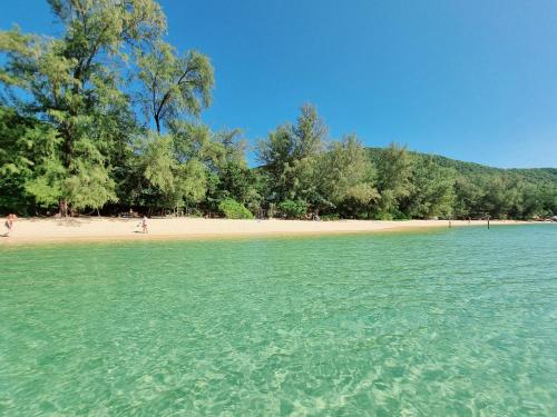 a view of a beach with people in the water at SunBoo Beach Bungalows in Koh Rong Sanloem