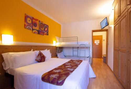 Postel nebo postele na pokoji v ubytování Hotel San Giusto