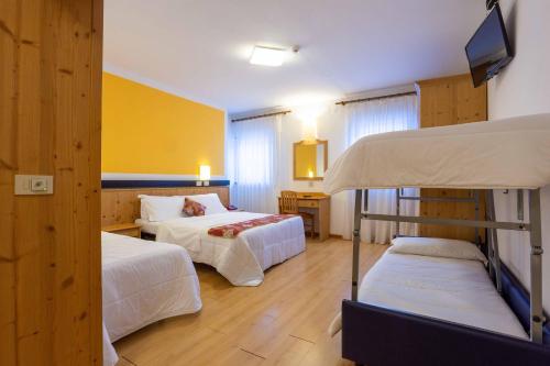 Postel nebo postele na pokoji v ubytování Hotel San Giusto