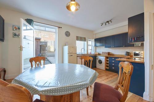 a kitchen with a table and chairs in a kitchen at Host & Stay - The Cottage in Corbridge in Corbridge