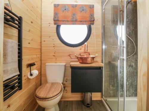 a bathroom with a toilet and a sink and a shower at Yealm in Plymouth