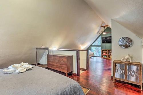 a bedroom with a bed and a dresser and a window at Peaceful Oak Haven Cabin near Yosemite in Mariposa