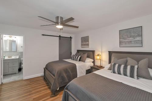 a bedroom with two beds and a ceiling fan at Modern Twist In A Historic Building, Sleeps 6 in Atlanta