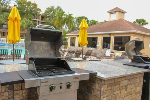 a outdoor grill with a laptop on top of it at Liki Tiki Village in Orlando