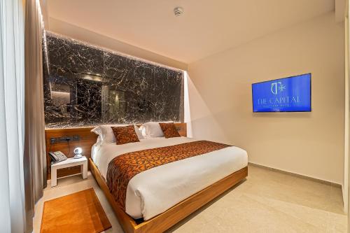 a bedroom with a bed with a leopard print blanket at The Capital Boutique Hotel in Valletta