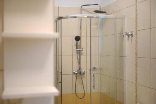 a shower with a shower head in a bathroom at Sea View Home - Rena's House in Corfu
