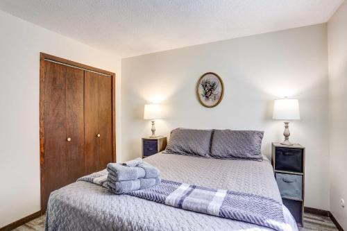 a bedroom with a bed with two towels on it at Pet-Friendly Pierre Vacation Rental! in Pierre