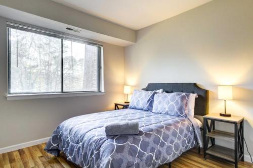 a bedroom with a bed and a window at Raleigh Condo Near Campus and Museums! in Raleigh