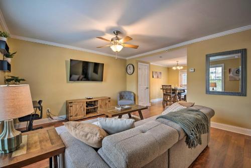 a living room with a couch and a table at Smyrna Vacation Rental about 2 Mi to The Battery! in Smyrna