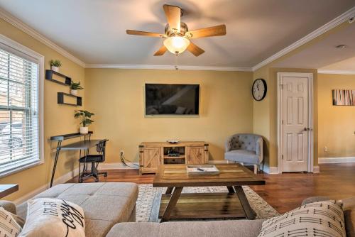 a living room with a couch and a ceiling fan at Smyrna Vacation Rental about 2 Mi to The Battery! in Smyrna