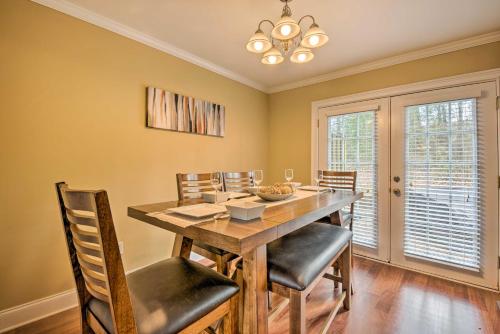 a dining room with a wooden table and chairs at Smyrna Vacation Rental about 2 Mi to The Battery! in Smyrna