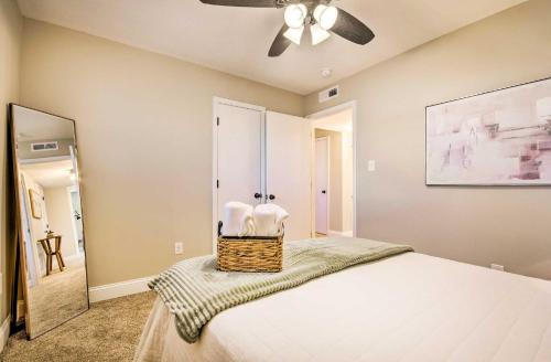 a bedroom with a bed and a ceiling fan at Spacious Columbia Vacation Rental Near Mizzou in Columbia