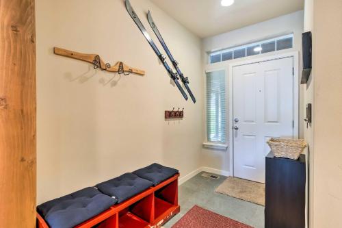 a room with a bench and skis on the wall at Kouls Retreat Condo 2 Mi to Lake Wenatchee in Leavenworth
