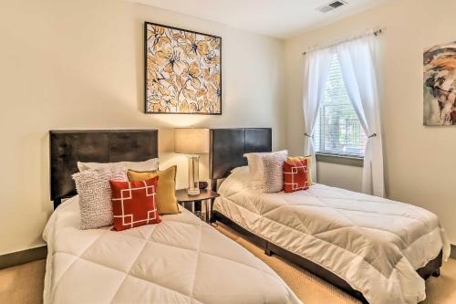 a bedroom with two beds and a window at Dwtn Condo 4 Blocks to The Wilmington Riverwalk! in Wilmington