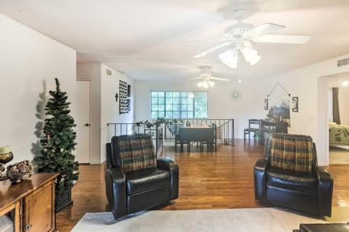 a living room with two chairs and a christmas tree at Patio and Yard Dtwn Cottonwood Home! in Cottonwood