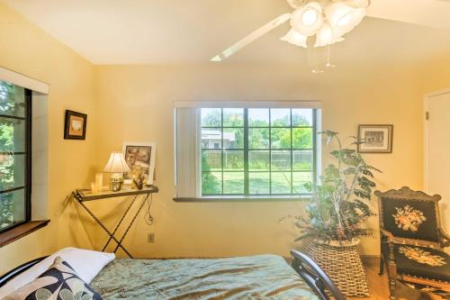 a bedroom with a bed and a window at Patio and Yard Dtwn Cottonwood Home! in Cottonwood