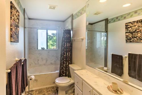 a bathroom with a shower and a toilet and a sink at Downtown Cottonwood Home with Hot Tub and Patio! in Cottonwood