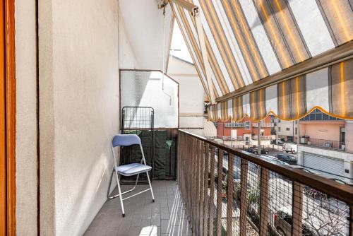 a chair sitting on the balcony of a building at Residence Fragole Apartment Venice in Campalto