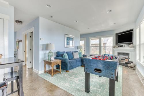 a living room with a large foosball table in the middle at The Bellevue in Lincoln City