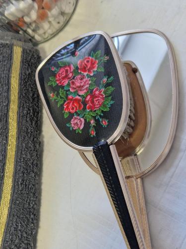 a rear view mirror with a flower pattern on it at Kuća za odmor "Vila Marina" in Klokočevik