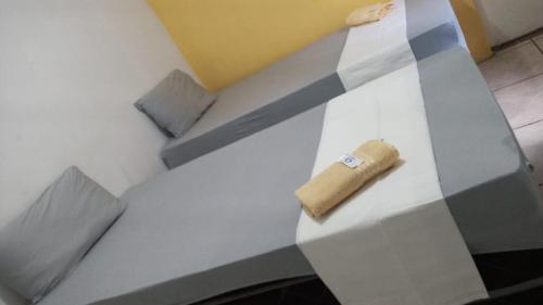 a table with a napkin on top of it at Casa Aeroporto Pousada in Recife