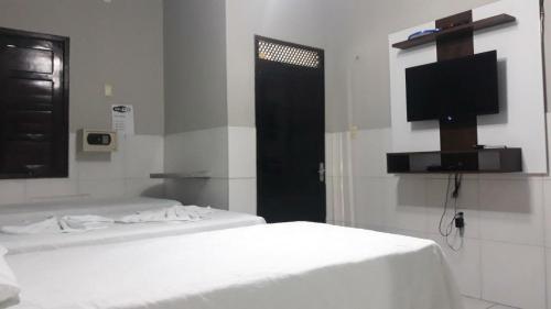 Cama o camas de una habitación en Hotel Oásis