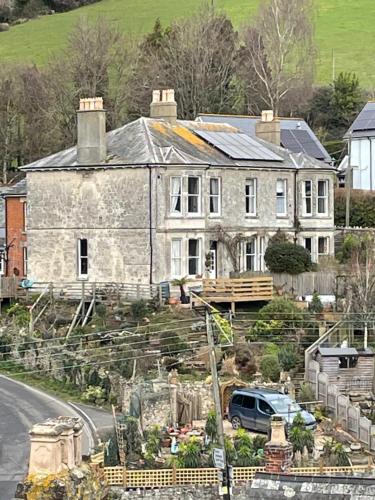 a large house on the side of a road at Southernhay in Beer