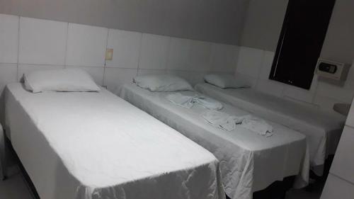 Cama o camas de una habitación en Hotel Oásis