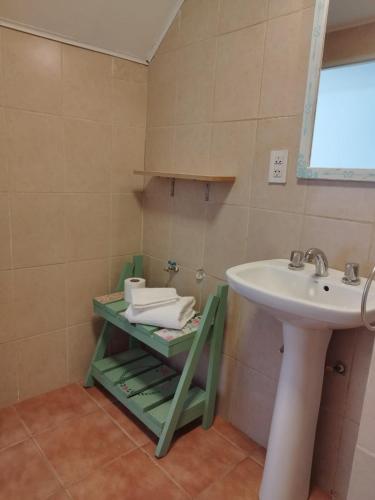 a bathroom with a sink and a white sink at Centro Rio Gallegos in Río Gallegos