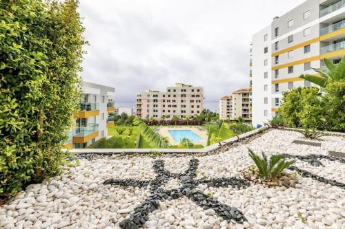 a view of the pool from the apartment building at Luxury poolside view apartment in Funchal