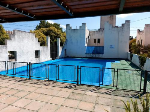 an empty swimming pool in an old building at Castillo Del Lago - Carlos Paz - D07 in Villa Carlos Paz