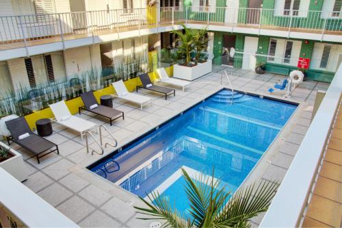 an overhead view of a swimming pool in a hotel at The Adler a Hollywood Hotel in Los Angeles