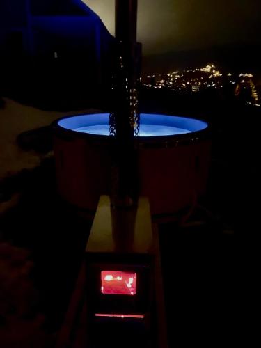 a pot of water is being poured into a clock at Somnium Pieniny in Tylka