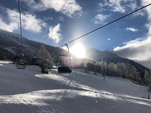 a ski lift on a snow covered ski slope at Appartement Flora in Saas-Almagell