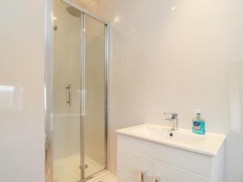 a bathroom with a shower and a sink at Rivendell in Holmfirth