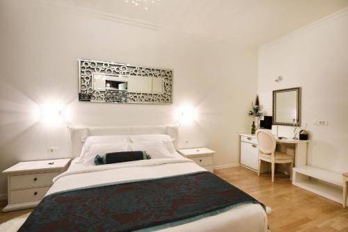 A bed or beds in a room at Adriaticum Luxury Accommodation